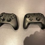 Nintendo Pro Controller next to Xbox One X controller